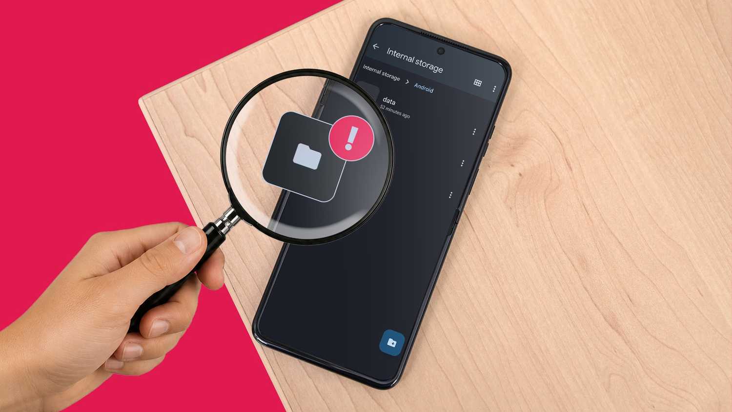 Android phone storage folder being inspected with a magnifying glass and warning icon.
