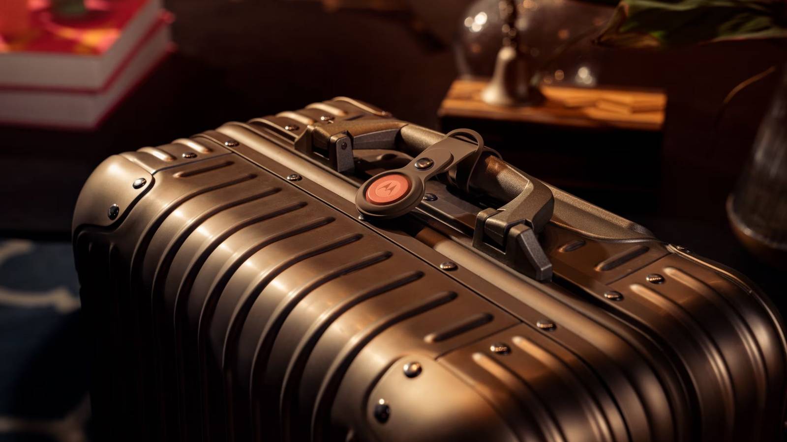 Moto Tag 2 on suitcase