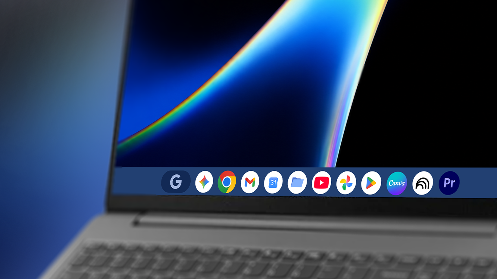Googlebook laptop showing a taskbar with Google and creative app icons.