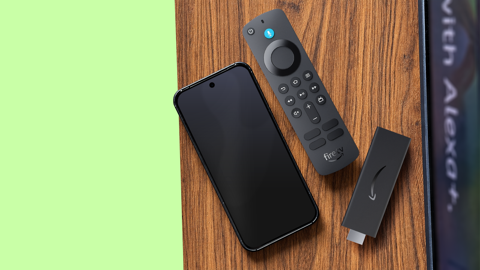 Spare Android phone next to an Amazon Fire TV Stick and remote.