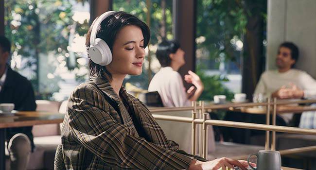 Person wearing Sony WH-CH720N in public