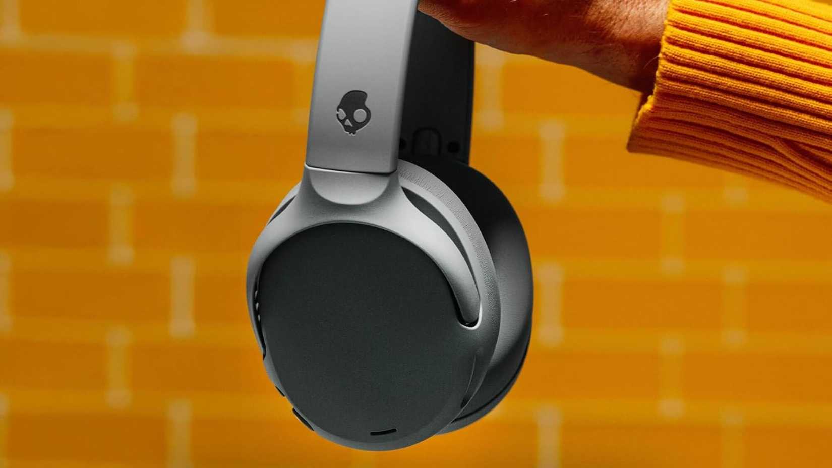 Person holding Skullcandy Crusher 720