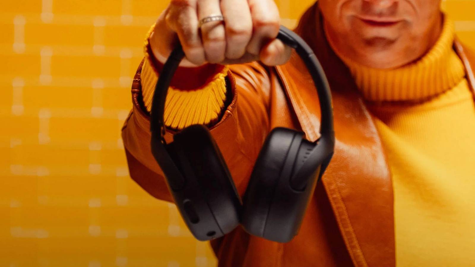 Person holding Skullcandy Crusher 720