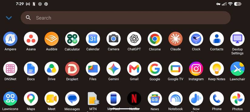 Android desktop app drawer open with search bar and applications grid