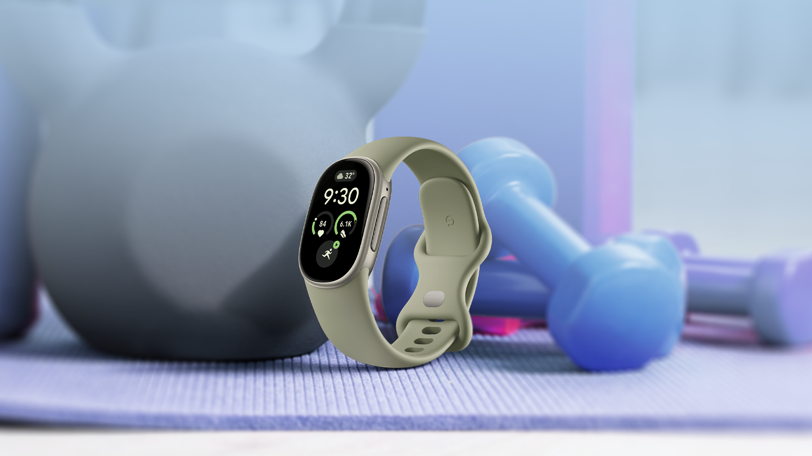 Fitbit Edge smartwatch in front of fitness equipment.
