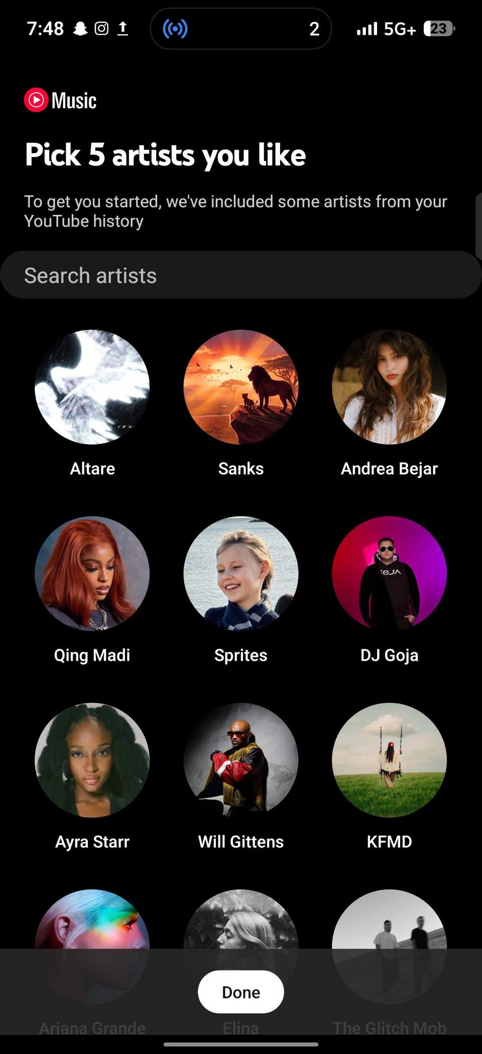 YouTube Music displays Pick 5 artists you like selection screen featuring circular artist icons
