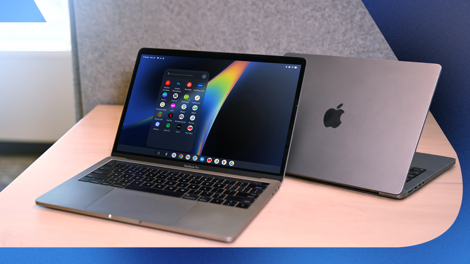 Two MacBook Pros on a desk, one displaying Googlebook OS.