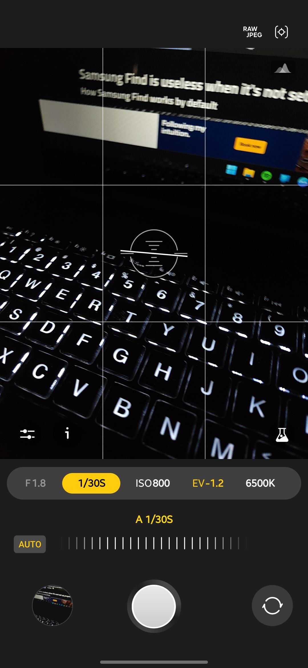 Expert RAW camera app with the shutter speed control selected and set to auto at 1/30s pointed at a backlit laptop keyboard