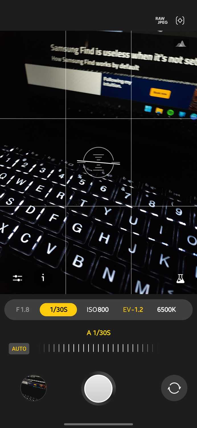 Expert RAW camera app with the shutter speed control selected and set to auto at 1/30s pointed at a backlit laptop keyboard