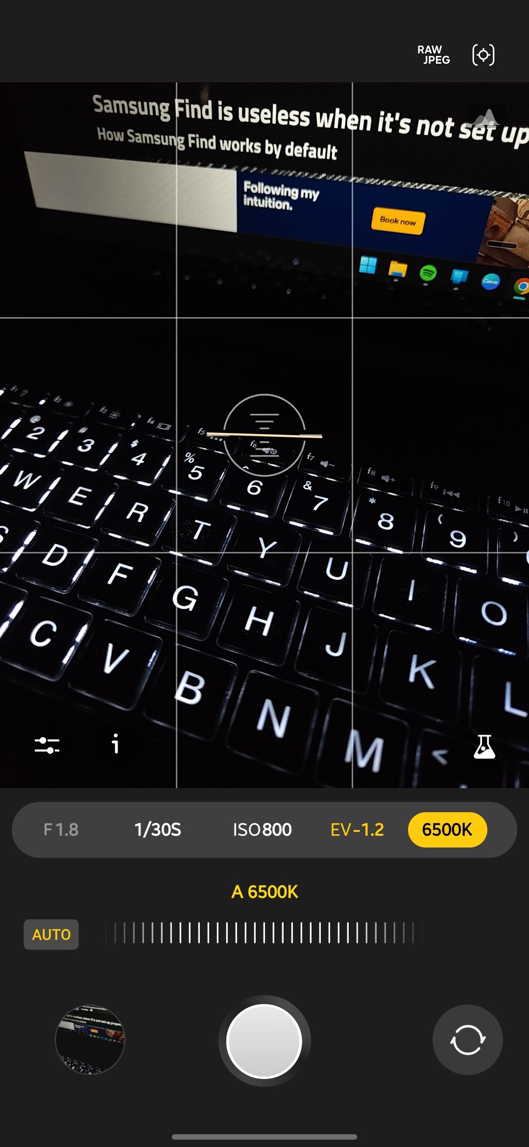Expert RAW camera app with the white balance control selected and set to auto at 6500K, showing a backlit laptop keyboard in a dark room