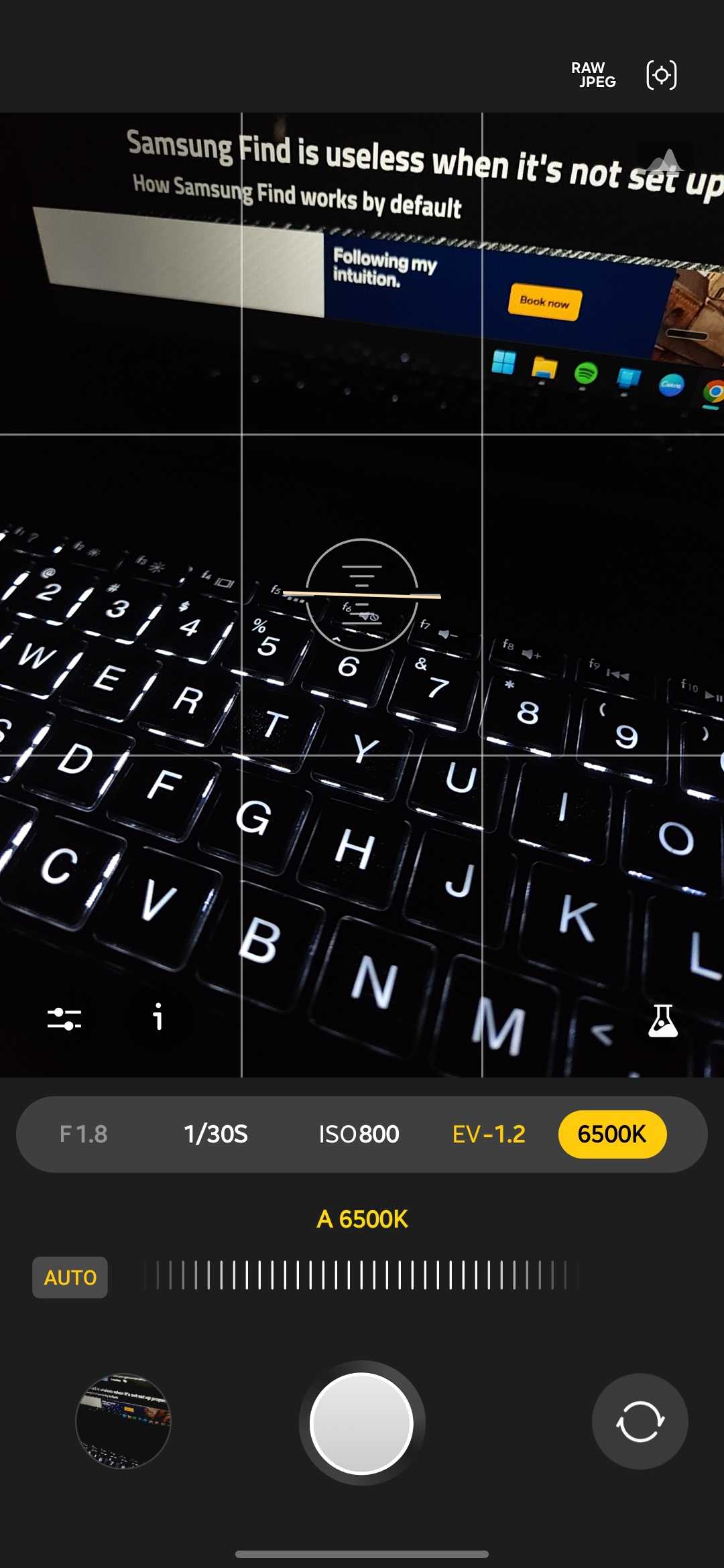 Expert RAW camera app with the white balance control selected and set to auto at 6500K, showing a backlit laptop keyboard in a dark room