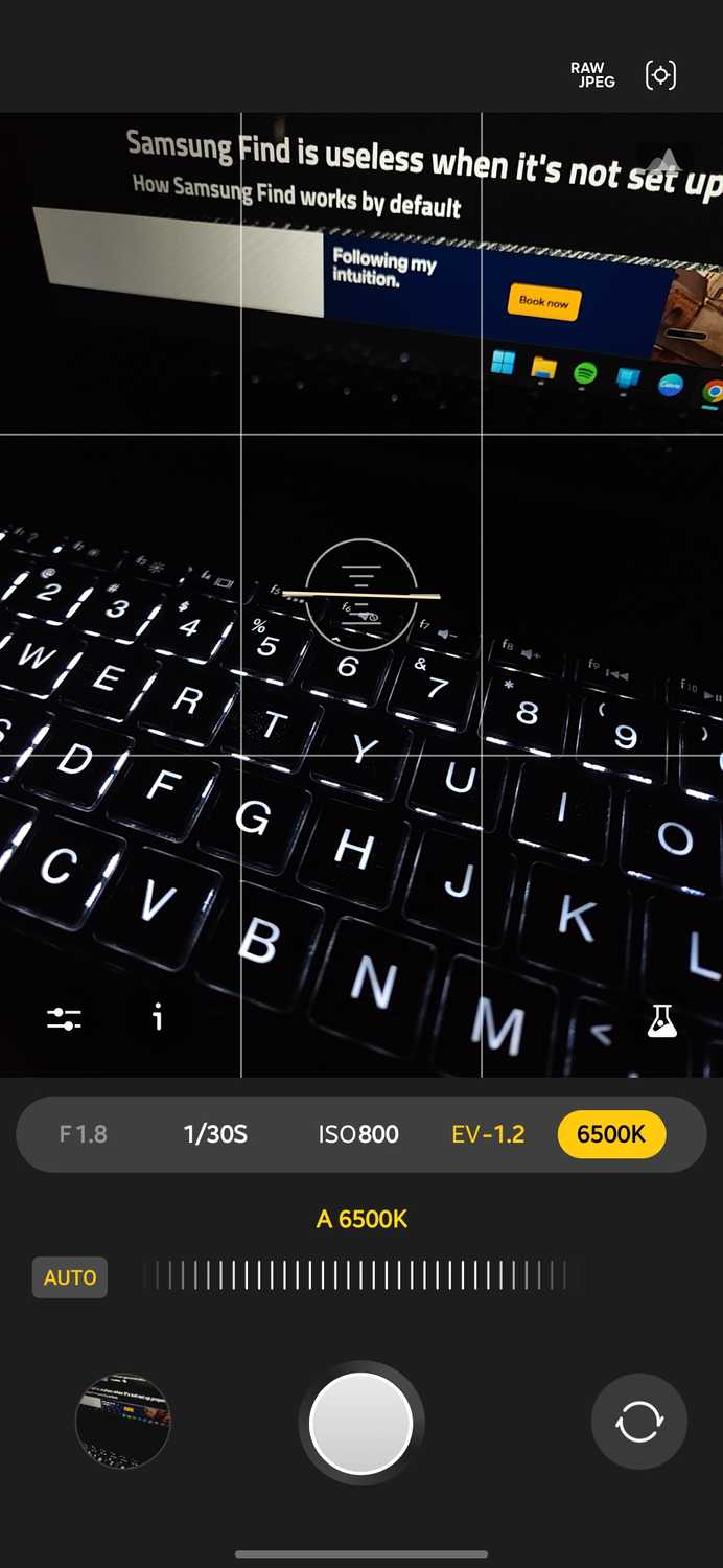 Expert RAW camera app with the white balance control selected and set to auto at 6500K, showing a backlit laptop keyboard in a dark room