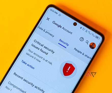 The Google account security settings screen captured on a phone placed on a yellow background.