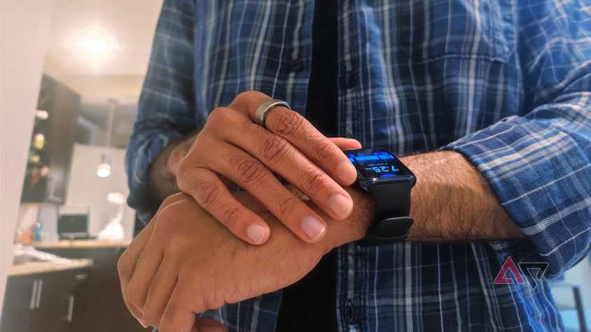 A person wearing a smart episode while using a smart watch