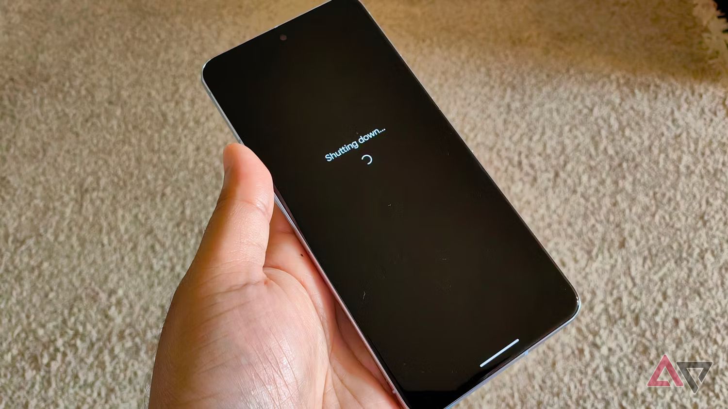 pixel 8 pro held in hand as it is shutting down