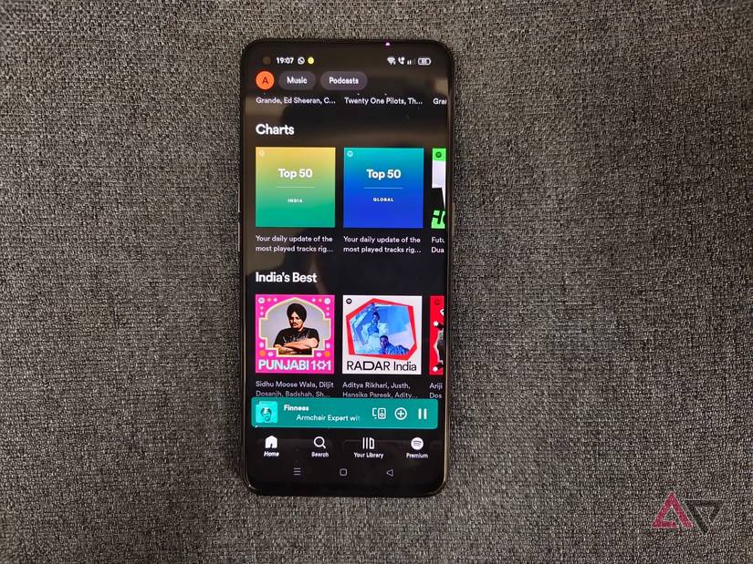 Photo of a phone showing Spotify's home screen
