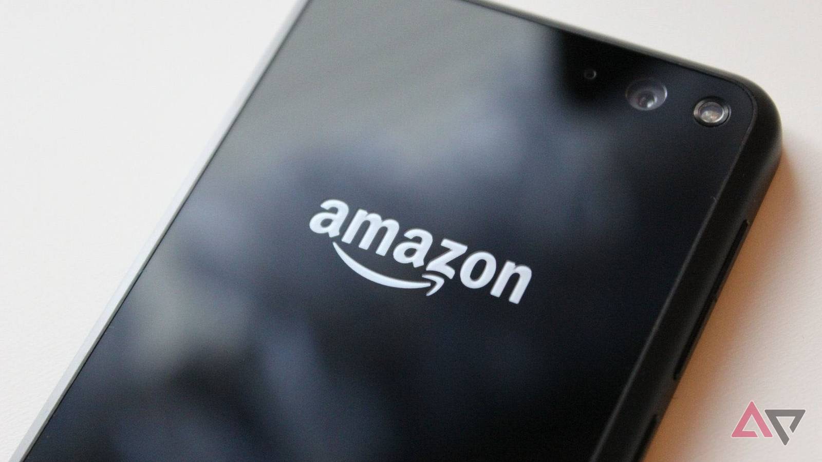 The back of the Fire Phone laying on a table.