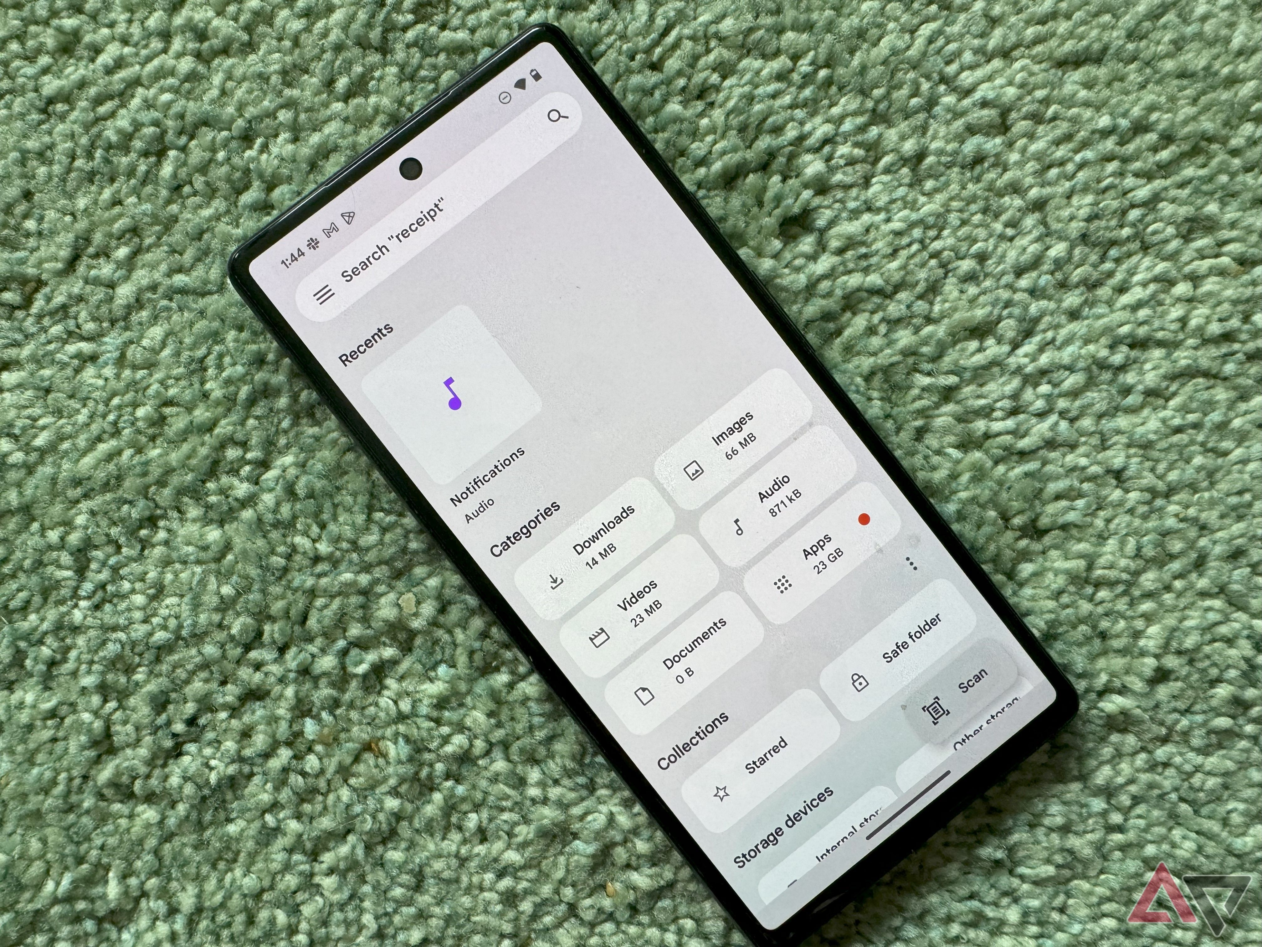 A Pixel on a green carpet with the Google Files open.