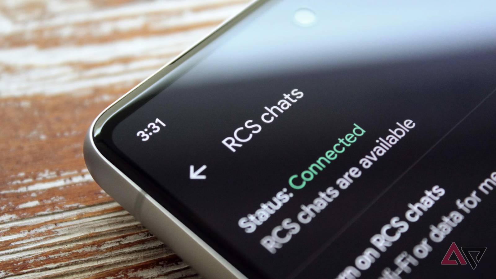Closeup of a phone showing RCS chats settings on its screen.