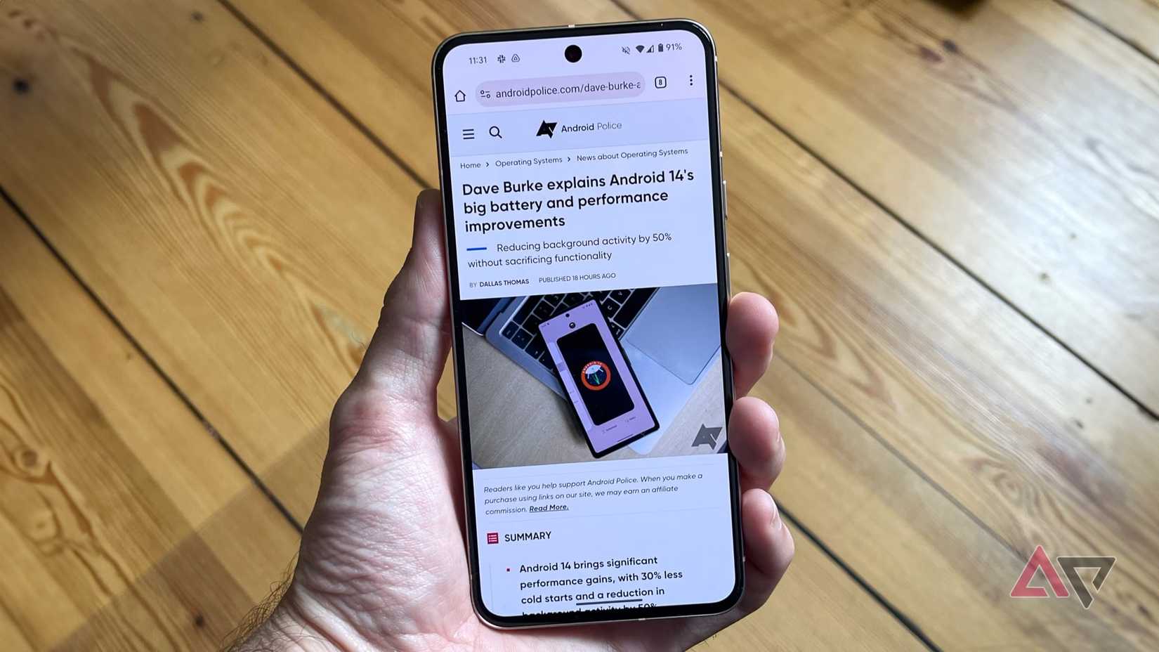 Chrome displayed on a Pixel 8 held in a hand with a wood background.