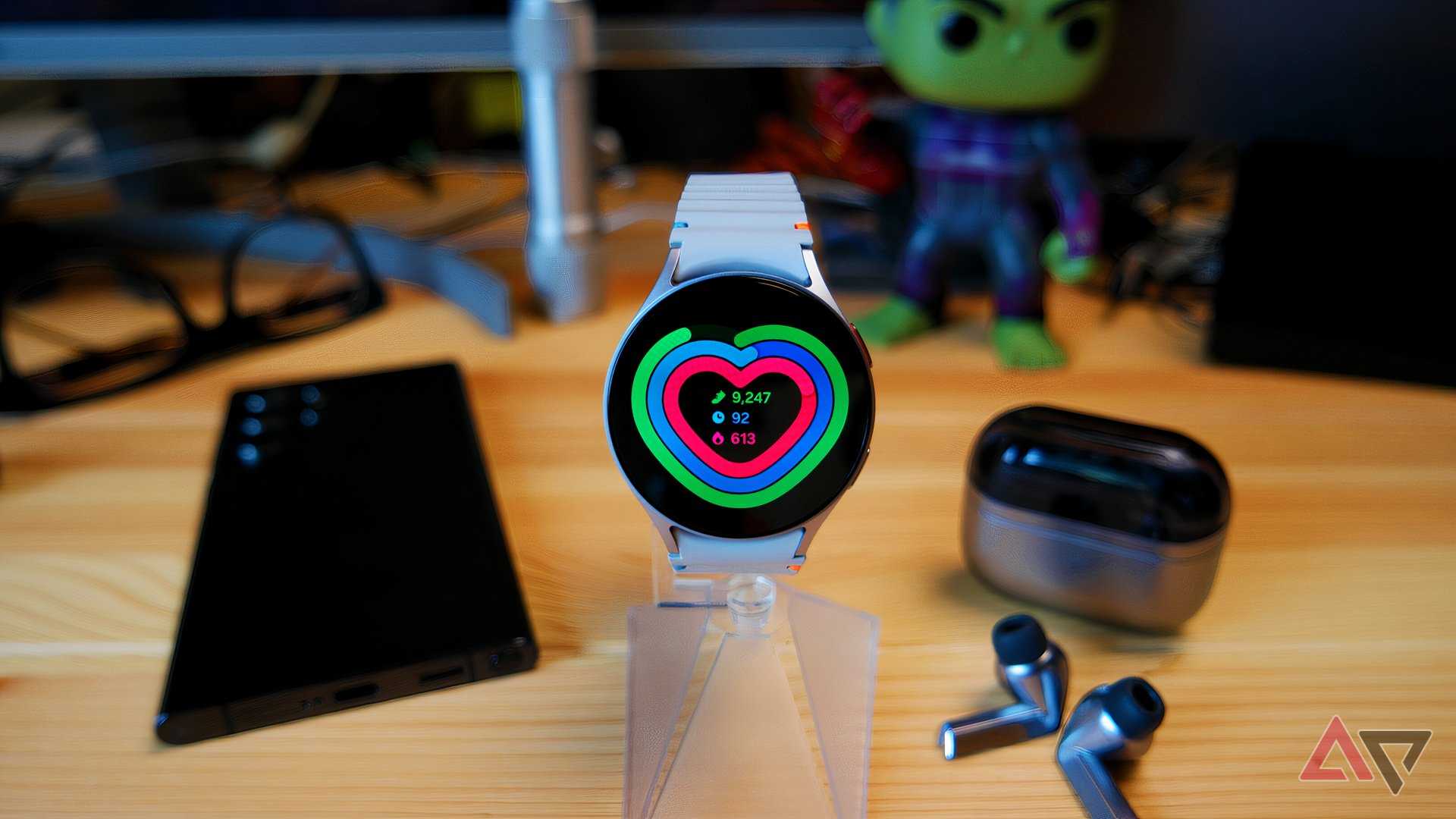 Samsung Galaxy Watch 7 on a watch stand showing the status of your health rings