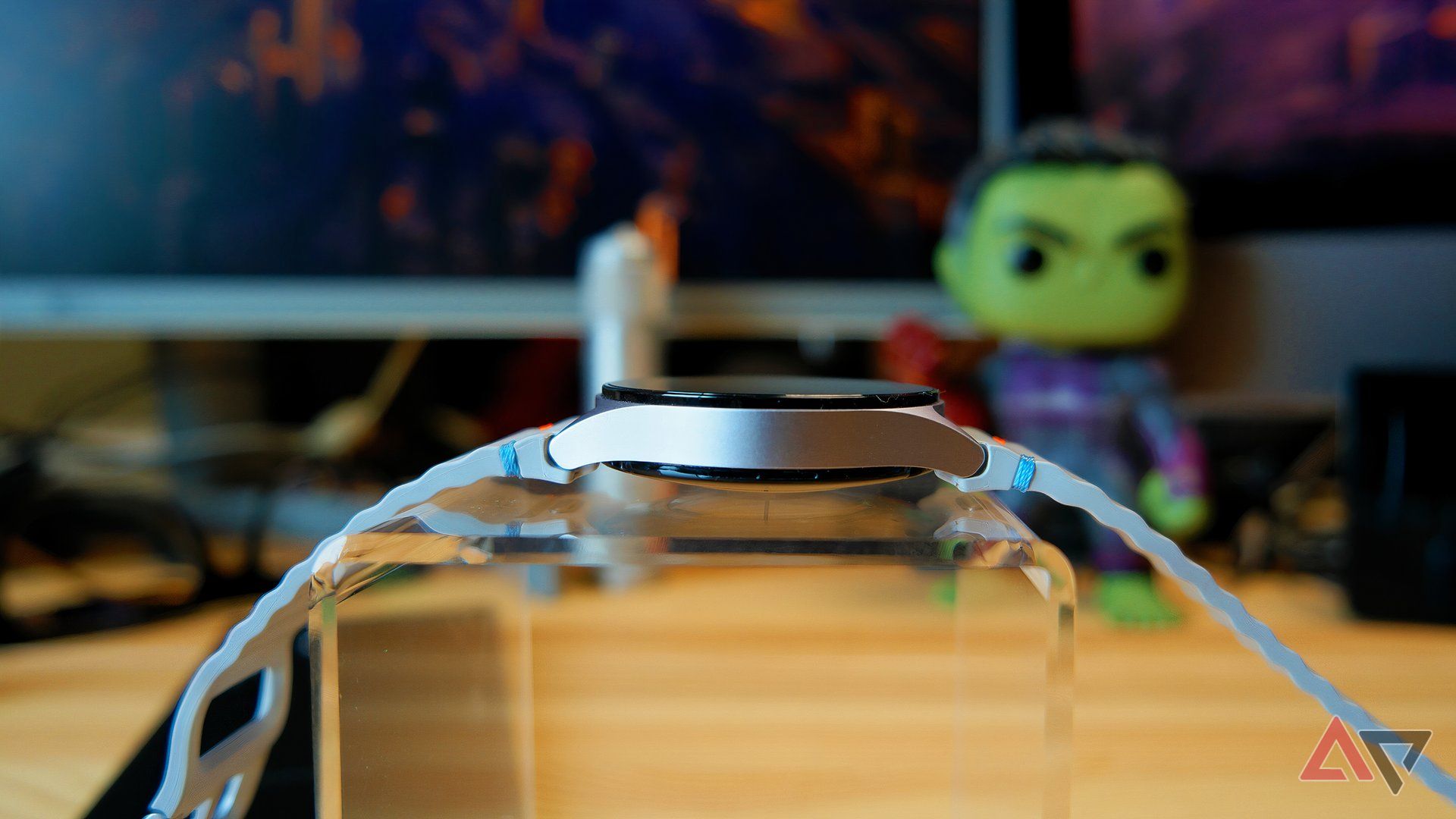 Samsung Galaxy Watch 7 on a stand showing the thickness of the watch body