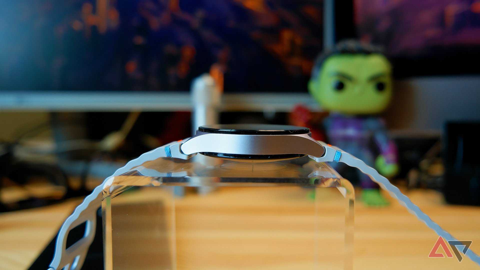 Samsung Galaxy Watch 7 on a stand showing the thickness of the watch body