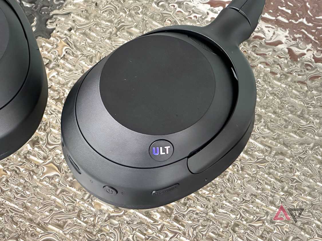 Sony Ult Wear headphones on a table with water droplets
