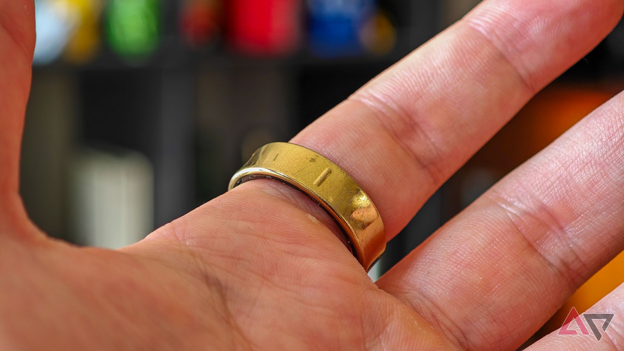 A gold Samsung Galaxy Ring on someone