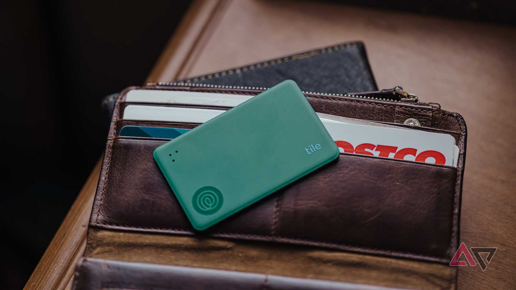 Tile Slim (2024) in green sitting on wallet