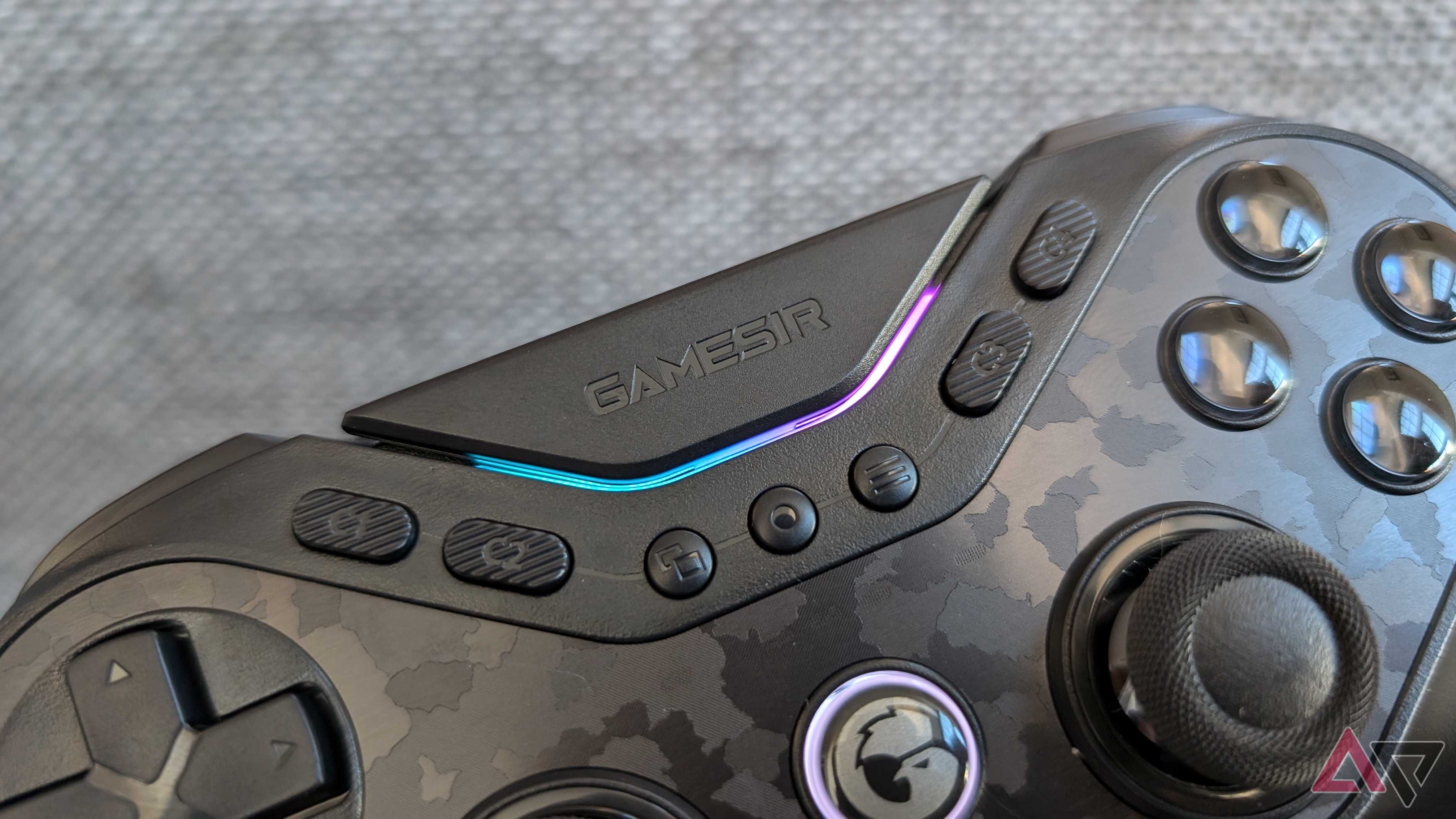 face buttons and blue and pink LEDs on black gamesir controller