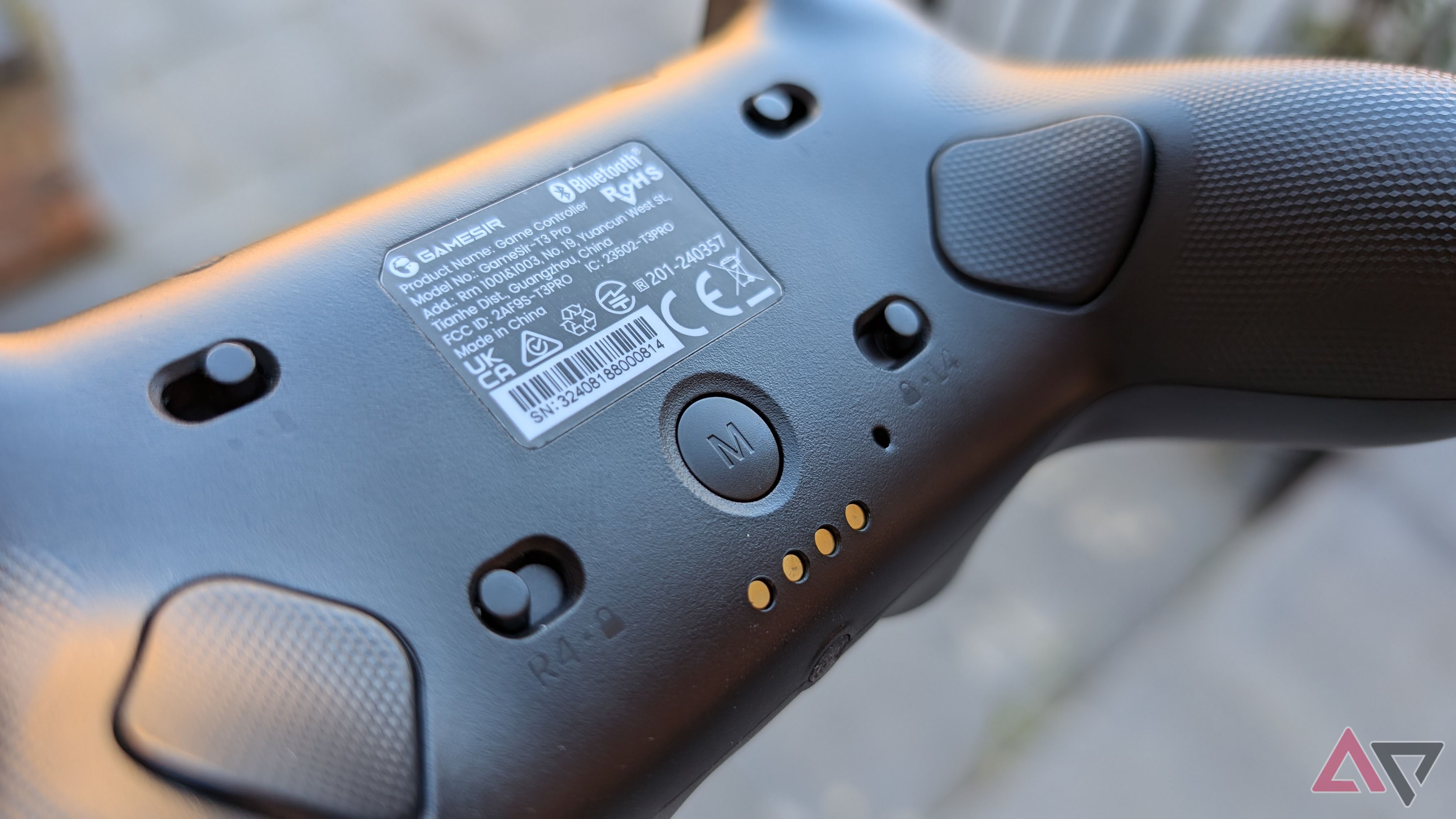 back of black gamesir controller showing switches and triggers