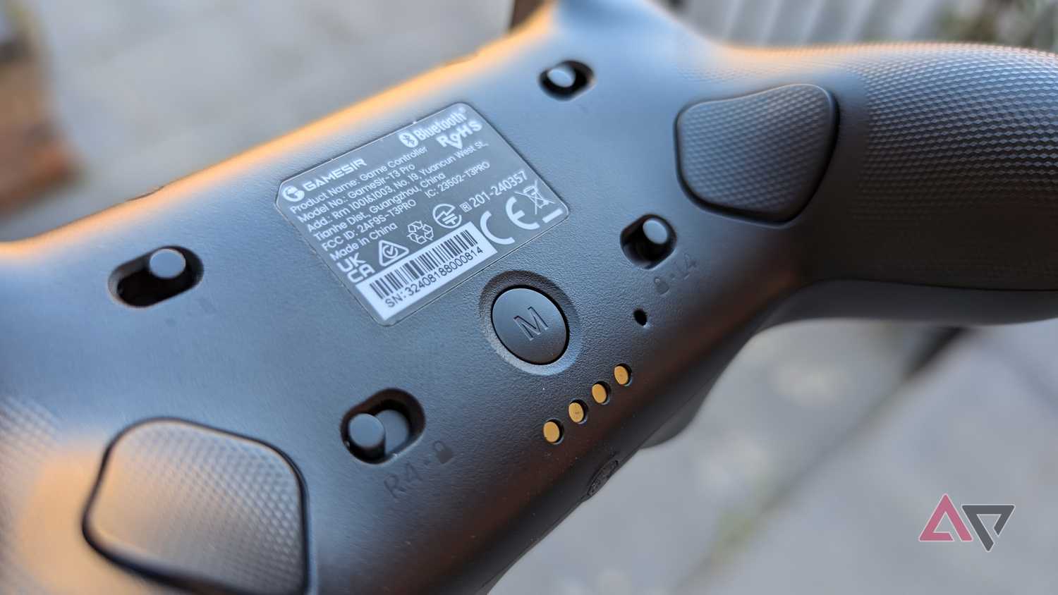 back of black gamesir controller showing switches and triggers