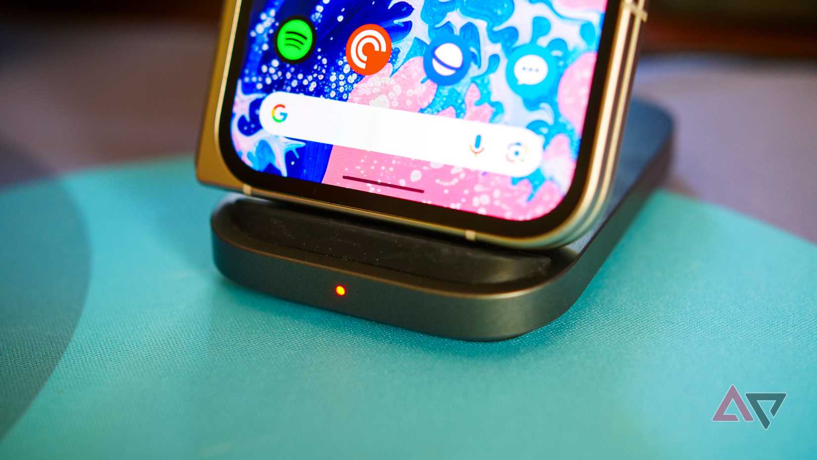 The Pixel 9 Pro Fold sitting on a wireless charging dock.