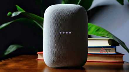 You will have to think carefully ahead of purchasing a Google Nest speaker presently A Nest Audio speaker in front of a stack of books.
