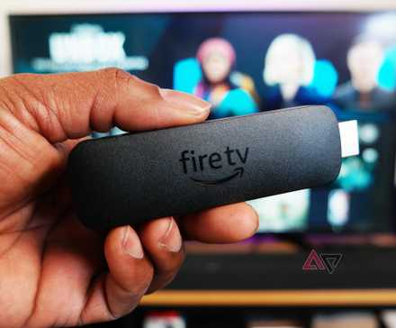 Amazon Fire TV Stick 4K body only, shown in front of TV running Fire OS