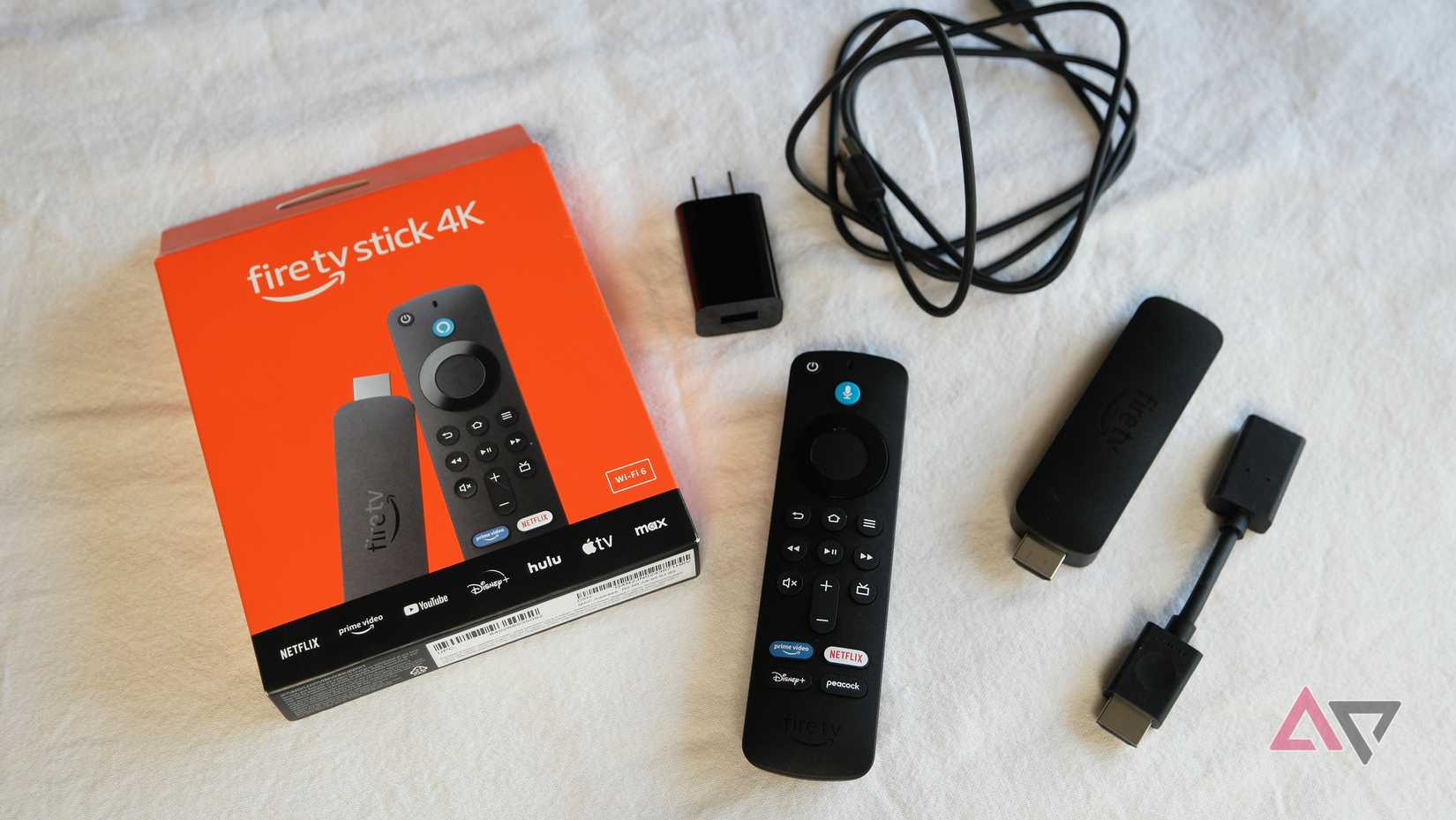 Amazon Fire TV Stick 4K (2nd Gen) showing most of what's inside the box. Quick start guide not shown.