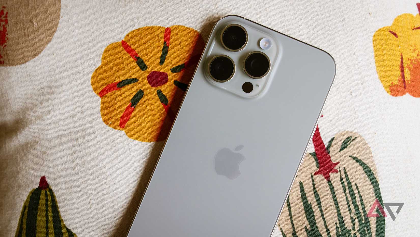 The iPhone 16 Pro Max shown against pumpkins.