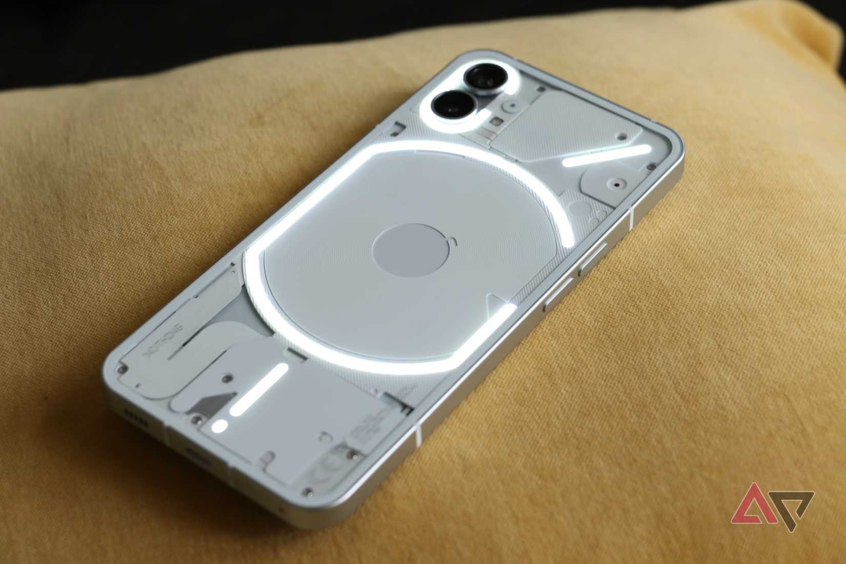 Nothing Phone 1 lying face down with Glyph light enabled