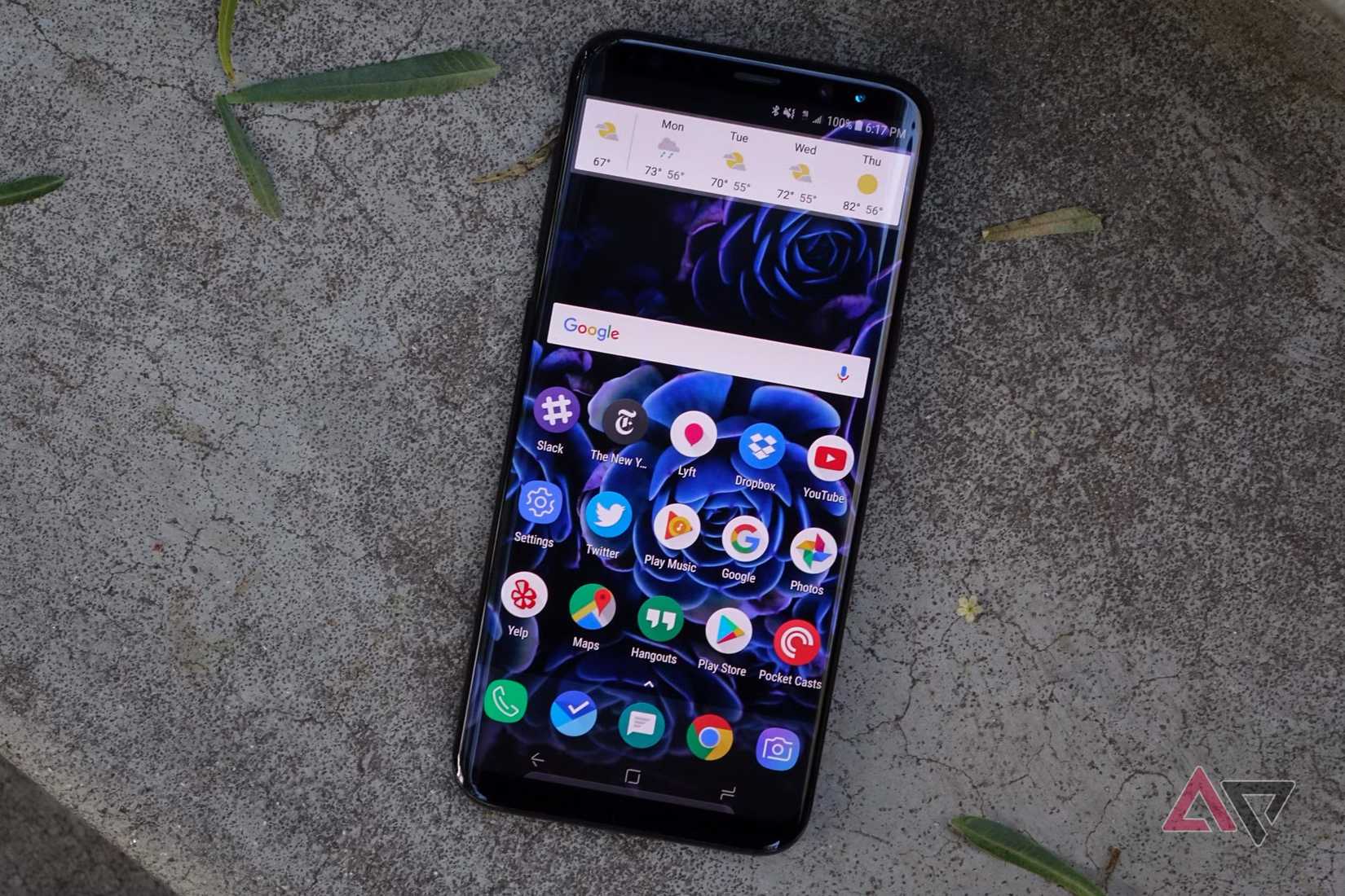 a samsung galaxy s8 plus phone on concrete