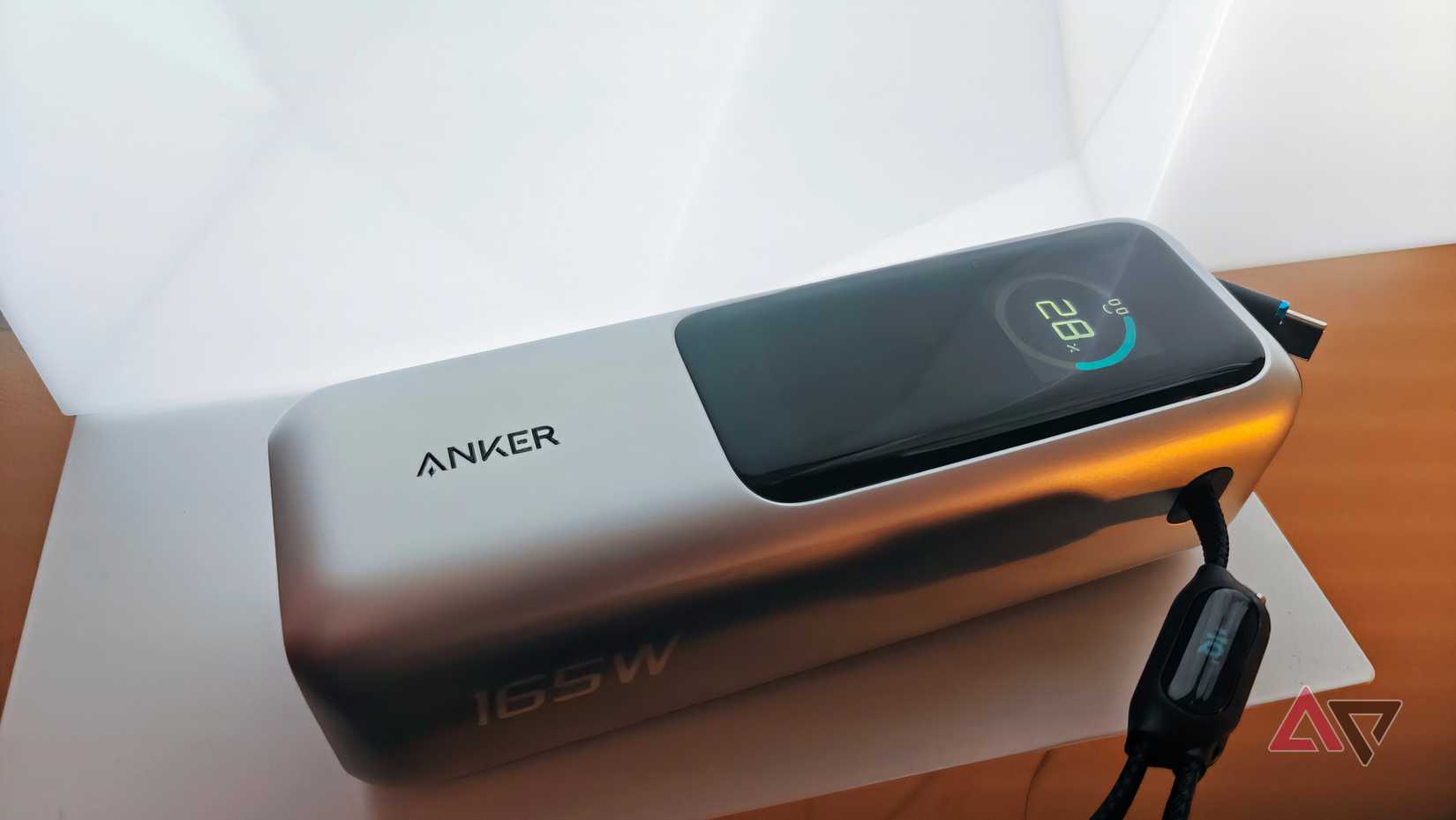 Anker 25k Laptop power bank on shelf in front of a light panel