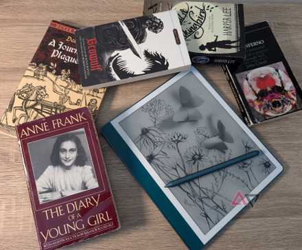 The emerald Kindle Scribe (2024) surrounded by classic literature