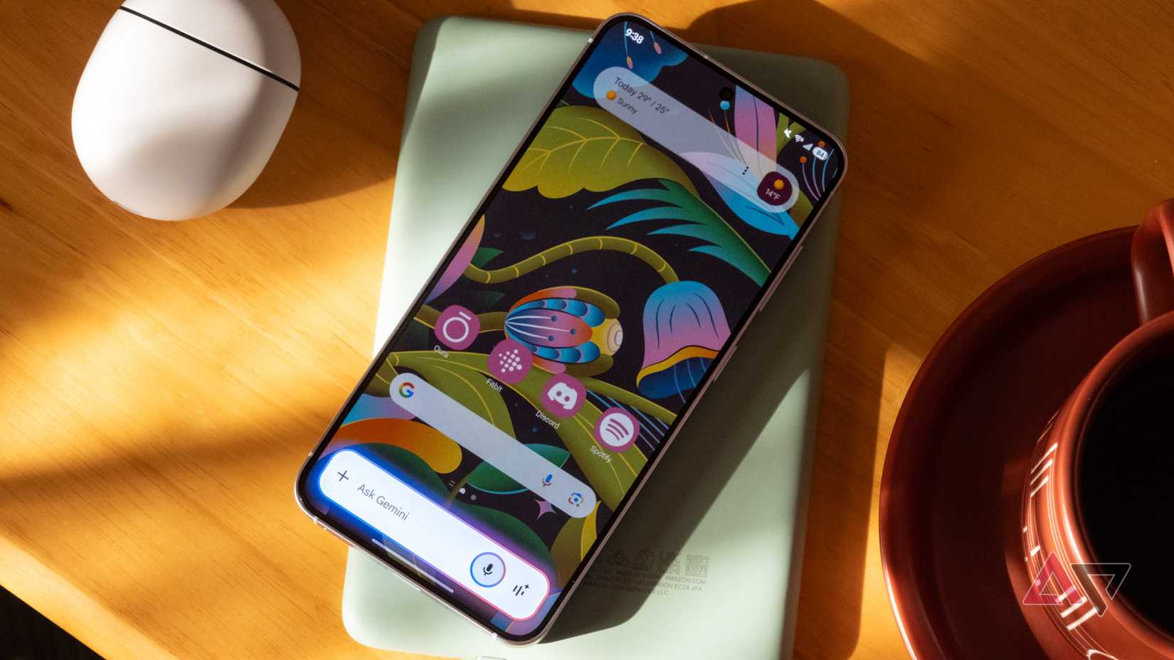 The Samsung Galaxy S25 with Google Gemini activated on a wooden table