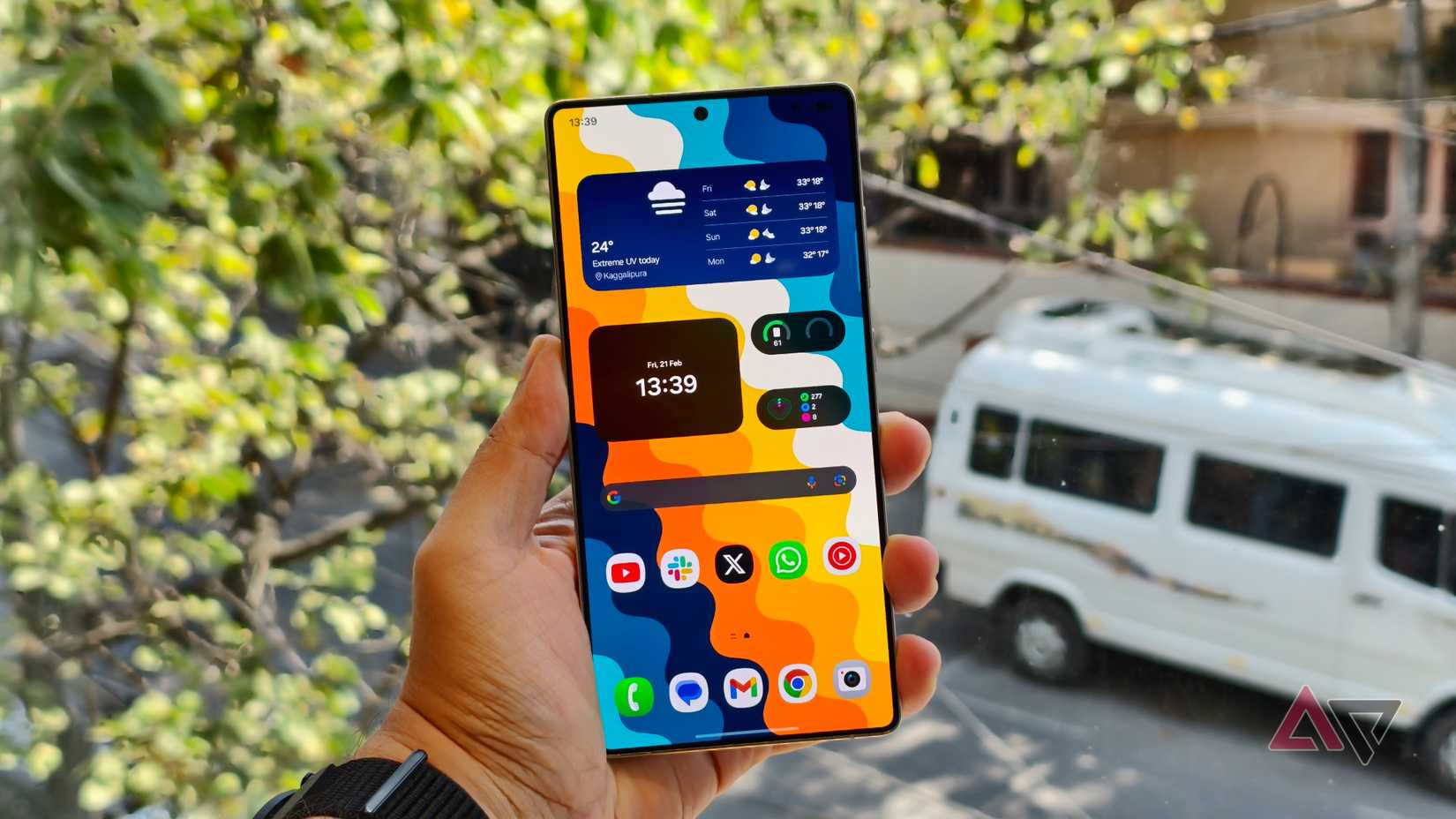A person holding the Galaxy S25 Ultra showing the home screen