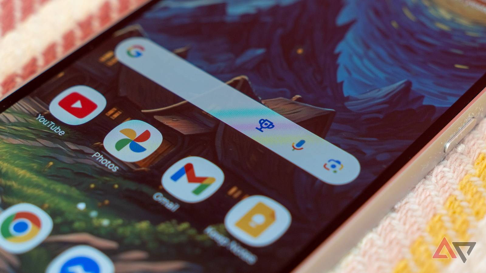 a closeup of a phone with focus on the google search widget