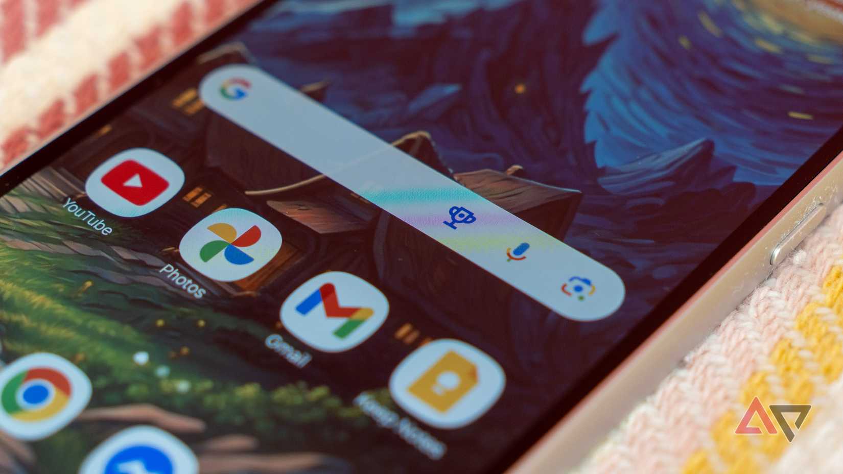 a closeup of a phone with focus on the google search widget