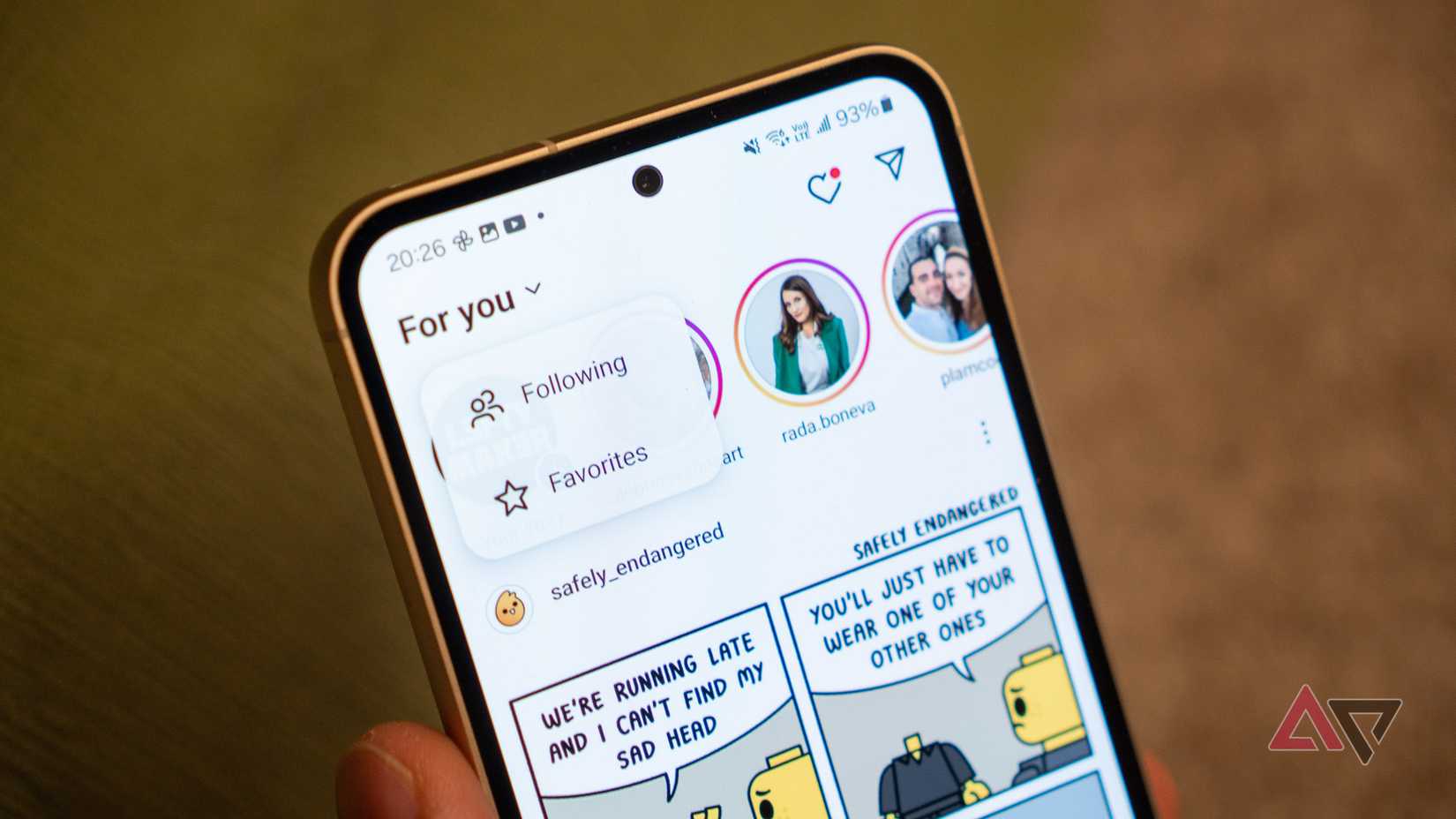 a closeup of a phone showing the instagram home page with the for you menu open