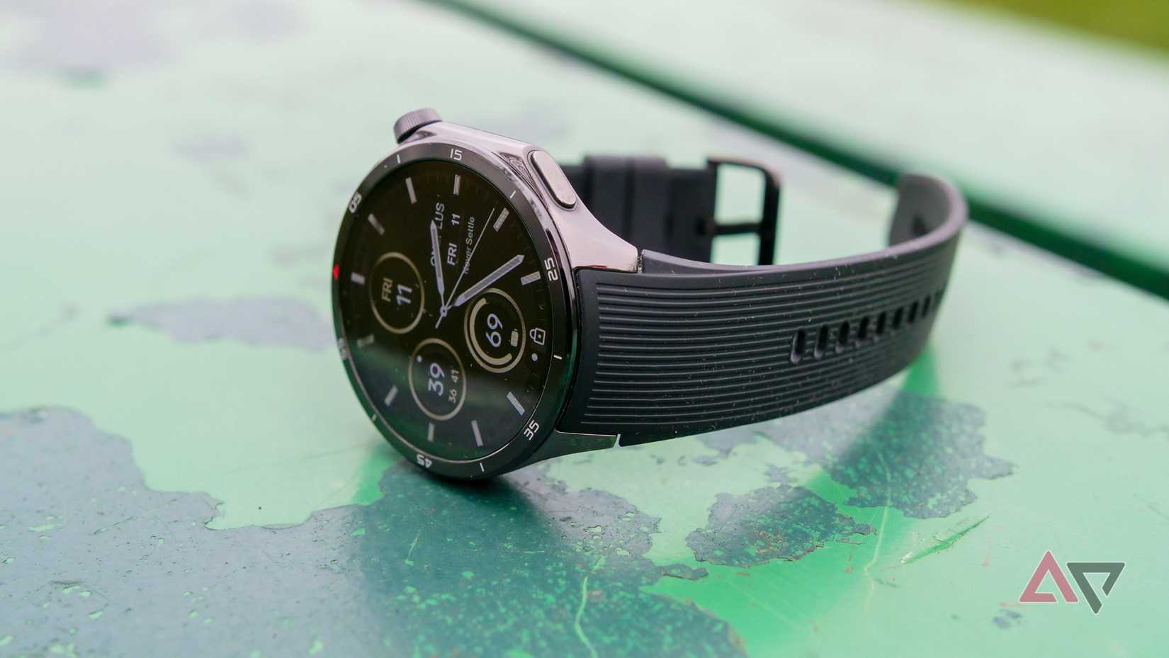 The OnePlus Watch 3 on a green bench.