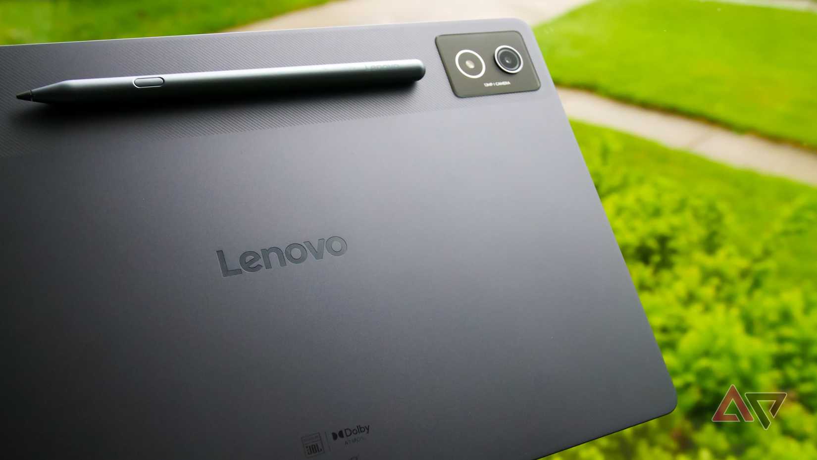 The Lenovo Idea Tab Pro with the stylus attached held in a hand.