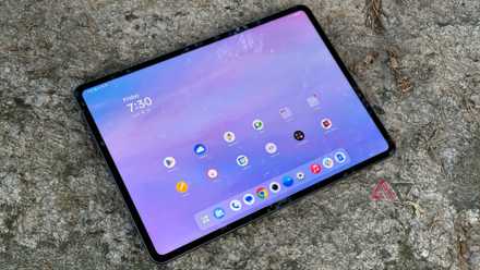 OnePlus Pad 3 up against a rock at dusk